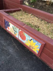 Garden bed mosaics by after school students